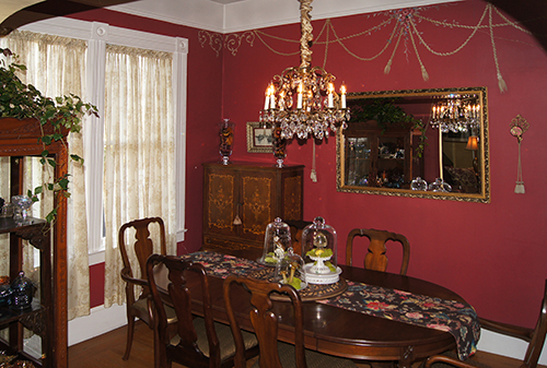 Trompe l'oeil swags on the wall of a Victorian dining room